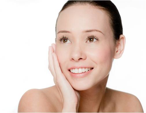 Woman touching her skin after a skin renewing procedure