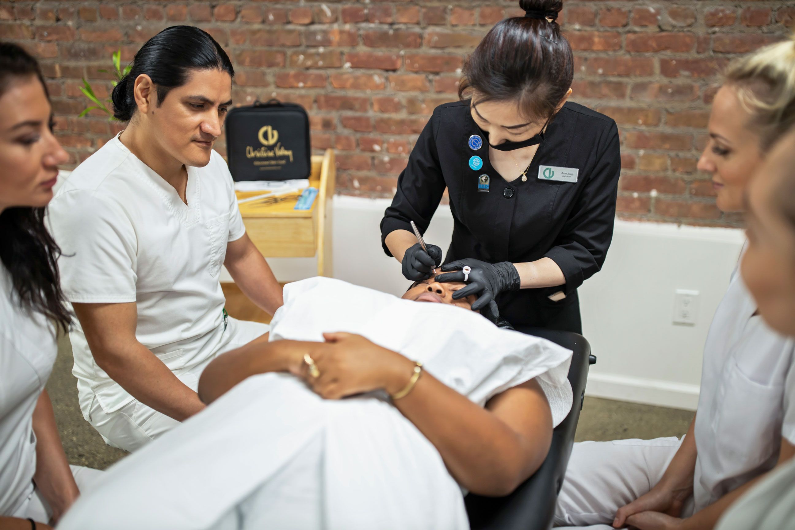 Christine Valmy esthetics instructor demonstrating the Microblading procedure to seminar attendees