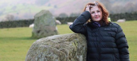 Woman with graying hair in nature