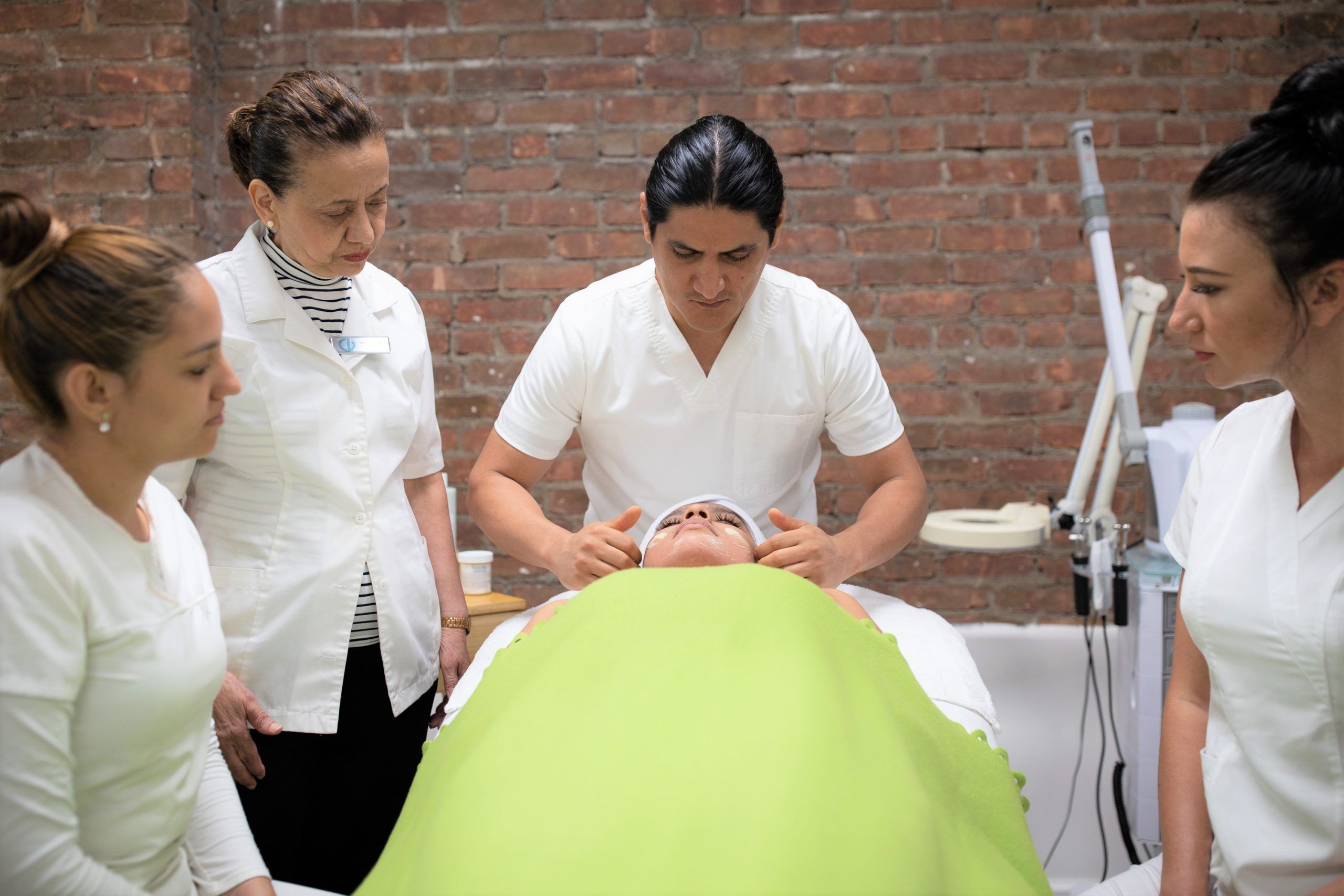 NY Esthetics Instructor giving a Facial Demonstration