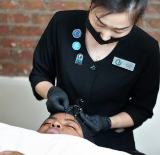 CV Instructor giving a Microblading demonstration