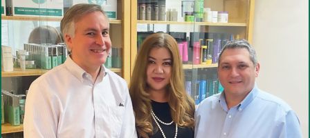 Newest Members of Christine Valmy's Leadership Team standing in front of a shelf of products